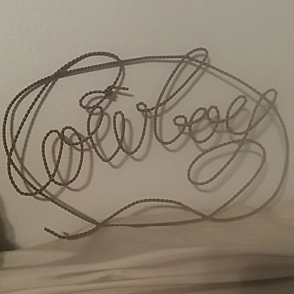 Free with $20 purchase. Cowboy metal art